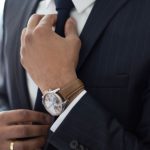 Suit - man wearing watch with black suit