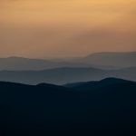 Layering - silhouette of mountains during sunset