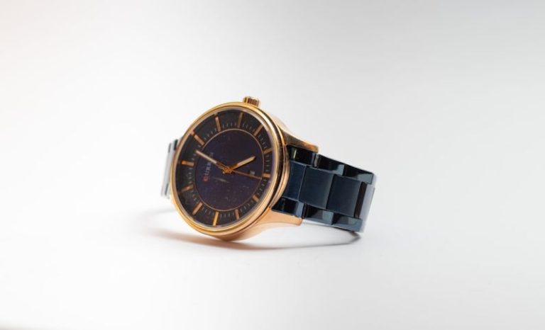 Accessories - gold and black round analog watch