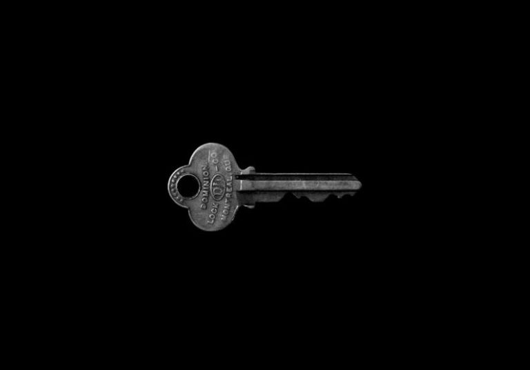 Key Pieces - photo of key against black background