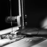 Fabrics - sewing machine grey-scale photography and close-up photography