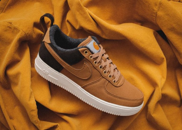 Shoes - brown Nike sneaker on yellow textile