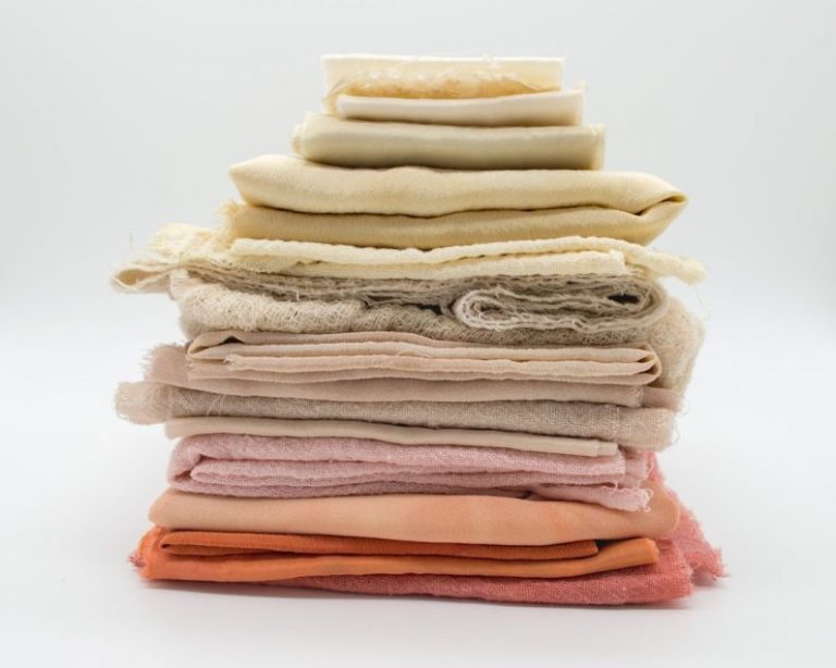 Fabrics - pile of cloth on white surface