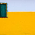 Colors - yellow and white painted wall with blue window