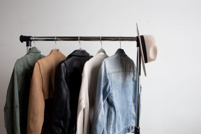 Jackets - one cowboy hat and five jackets hanged on clothes rack